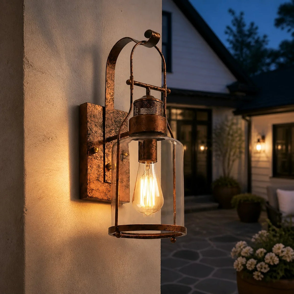 Dakota rust wall sconce glowing close up at night